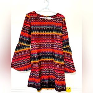 100% polestar retro dress with a Bohemian flair. Relaxed fit . Bell arms.